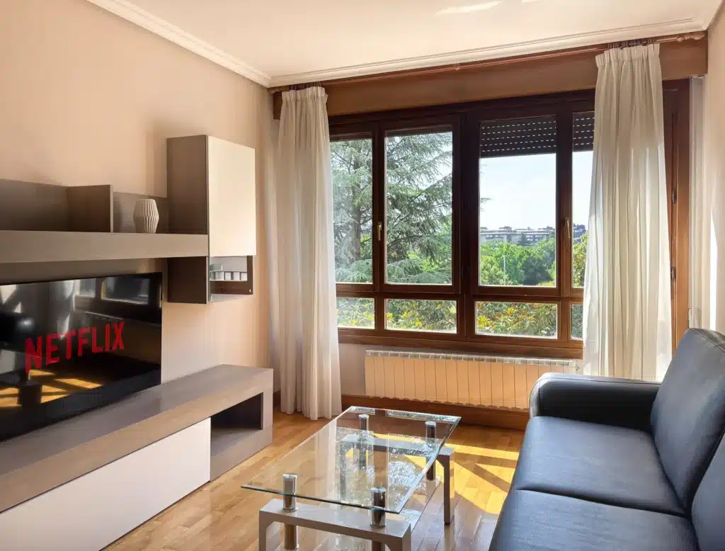Living room overlooking greenery in a 2-bedroom apartment in Pamplona